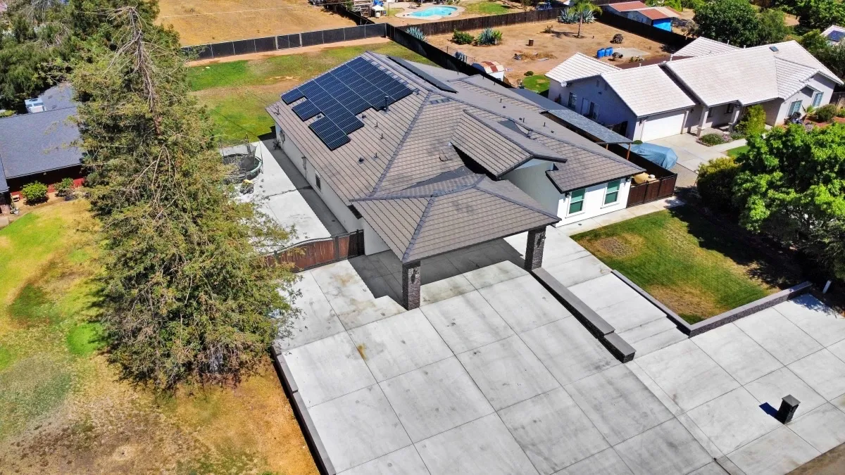 Technician cleaning residential solar panels
